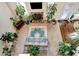 Open concept living room features a fireplace, and an abundance of plants at 609 Eskimo Ct, Cts, Hampton, GA 30228