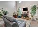 Inviting living area showcasing a stone fireplace, high ceilings and comfortable seating at 609 Eskimo Ct, Cts, Hampton, GA 30228