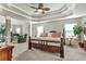 Spacious main bedroom with tray ceiling, sitting area, and natural light at 609 Eskimo Ct, Cts, Hampton, GA 30228