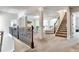Upstairs landing sitting area with decorative iron railing and an arched entrance at 609 Eskimo Ct, Cts, Hampton, GA 30228