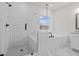 A luxurious bathroom featuring a separate shower and tub with elegant tile work at 683 Summitt Hill Way, Cumming, GA 30040