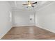 Spacious bedroom with tray ceiling, hardwood floors, and large windows for natural light at 683 Summitt Hill Way, Cumming, GA 30040