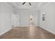 Spacious bedroom with tray ceiling, hardwood floors, and large windows for natural light at 683 Summitt Hill Way, Cumming, GA 30040