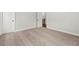 Bedroom with neutral carpet and white walls leading to an upstairs hallway at 683 Summitt Hill Way, Cumming, GA 30040