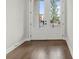 Welcoming entryway featuring a striking door with glass panels and beautiful hardwood flooring at 683 Summitt Hill Way, Cumming, GA 30040