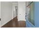 Inviting foyer with gleaming hardwood floors, a blue door, and neutral walls for a bright, open feel at 683 Summitt Hill Way, Cumming, GA 30040