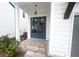 Stylish blue double front doors with brick steps and white pillars at 683 Summitt Hill Way, Cumming, GA 30040