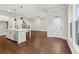 Bright, spacious kitchen featuring a large island, modern lighting, and hardwood floors at 683 Summitt Hill Way, Cumming, GA 30040
