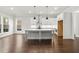 Bright and spacious kitchen with modern appliances, a large island, and hardwood floors at 683 Summitt Hill Way, Cumming, GA 30040