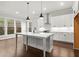 Stylish kitchen featuring modern appliances, a large center island, and hardwood flooring at 683 Summitt Hill Way, Cumming, GA 30040