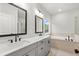 Main bathroom features double sink vanity, soaking tub, and a glass enclosed shower at 683 Summitt Hill Way, Cumming, GA 30040