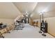 Large finished bonus room, featuring a ceiling fan, desk, lighting, and lots of room for activities at 755 Peninsula Overlook, Hampton, GA 30228