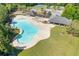 Aerial view of the community pool, cabana, and lounge chairs, offering a relaxing and recreational space at 755 Peninsula Overlook, Hampton, GA 30228