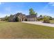 Spacious home with three-car garage, brick accents, well-kept lawn, and ample parking on long drive at 755 Peninsula Overlook, Hampton, GA 30228