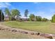 Scenic view of the lush green golf course with mature trees, well-manicured grass and community homes at 755 Peninsula Overlook, Hampton, GA 30228