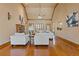 Bright living room with hardwood floors, a fireplace, and ample natural light at 755 Peninsula Overlook, Hampton, GA 30228