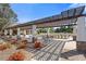 Inviting outdoor patio area with pergola, seating, and lush landscaping, perfect for relaxation at 755 Peninsula Overlook, Hampton, GA 30228