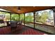 Inviting porch with a ceiling fan, outdoor furniture, and scenic views for relaxation at 1052 Secret Ne Trl, Sugar Hill, GA 30518