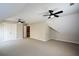 Bright bonus room featuring neutral decor, carpet, and an adjoining door leading to another space at 1052 Secret Ne Trl, Sugar Hill, GA 30518