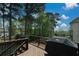Outdoor deck space with a grill is great for outdoor entertaining and relaxation at 1052 Secret Ne Trl, Sugar Hill, GA 30518