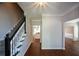 Spacious foyer with hardwood flooring and a staircase, with a view to other rooms at 1052 Secret Ne Trl, Sugar Hill, GA 30518