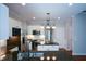 Lovely kitchen featuring granite countertops, a central island, and stainless steel appliances at 1052 Secret Ne Trl, Sugar Hill, GA 30518