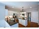 Bright kitchen featuring a granite island, stainless steel appliances, and ample cabinet space at 1052 Secret Ne Trl, Sugar Hill, GA 30518