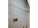 Bright laundry room featuring white wire shelving and hookups for appliances at 1052 Secret Ne Trl, Sugar Hill, GA 30518