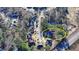 An aerial view of a suburban neighborhood showcasing the home nestled among mature trees at 1081 Talon Trce, Lawrenceville, GA 30043