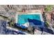 Aerial view of community pool with surrounding sun deck, loungers, and landscape at 1081 Talon Trce, Lawrenceville, GA 30043