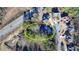 Aerial view of the home in relation to the surrounding neighborhood and pond at 1081 Talon Trce, Lawrenceville, GA 30043