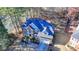 Aerial view of a brick home with a well-maintained yard, backing onto a tranquil lake at 1081 Talon Trce, Lawrenceville, GA 30043