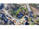 An aerial view of a suburban neighborhood showcasing the home nestled among mature trees at 1081 Talon Trce, Lawrenceville, GA 30043