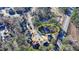 An aerial view of a suburban neighborhood showcasing the home nestled among mature trees at 1081 Talon Trce, Lawrenceville, GA 30043