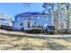 Spacious backyard with mature trees and a wooden deck perfect for entertaining at 1081 Talon Trce, Lawrenceville, GA 30043
