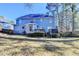 Expansive backyard featuring a deck, lush greenery, and a well-maintained lawn in a serene, wooded setting at 1081 Talon Trce, Lawrenceville, GA 30043