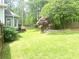 Spacious backyard featuring a well-maintained lawn and privacy fence at 1081 Talon Trce, Lawrenceville, GA 30043