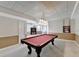 View of a basement featuring a red pool table, doorway, and a bookcase at 1081 Talon Trce, Lawrenceville, GA 30043