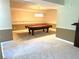 Finished basement with a pool table, carpet flooring and neutral colored walls at 1081 Talon Trce, Lawrenceville, GA 30043