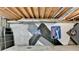 View of unfinished basement featuring logos painted on the concrete foundation at 1081 Talon Trce, Lawrenceville, GA 30043