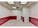 View of basement featuring two white doors and red wainscoting at 1081 Talon Trce, Lawrenceville, GA 30043
