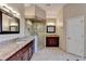 Spacious bathroom features a tiled shower with glass door and double sink vanity at 1081 Talon Trce, Lawrenceville, GA 30043