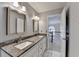 Bright bathroom with granite countertops, dual sinks, and modern fixtures at 1081 Talon Trce, Lawrenceville, GA 30043
