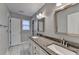 Modern bathroom featuring double sinks, granite countertops, and ample cabinet space at 1081 Talon Trce, Lawrenceville, GA 30043