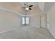 Large bedroom with vaulted ceilings, a ceiling fan, and natural light from corner windows at 1081 Talon Trce, Lawrenceville, GA 30043