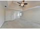 Spacious bedroom with neutral carpet and a tray ceiling, offering a blank canvas for personalization at 1081 Talon Trce, Lawrenceville, GA 30043