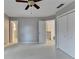 Bedroom featuring carpet flooring, ceiling fan, and doorway to hallway at 1081 Talon Trce, Lawrenceville, GA 30043