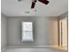 Bedroom with carpeted floors, ceiling fan and access to the hallway at 1081 Talon Trce, Lawrenceville, GA 30043