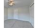 Neutral bedroom featuring a ceiling fan, closet, and ample natural light at 1081 Talon Trce, Lawrenceville, GA 30043