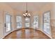 Cozy breakfast nook with hardwood floors, three windows, and access to the patio at 1081 Talon Trce, Lawrenceville, GA 30043